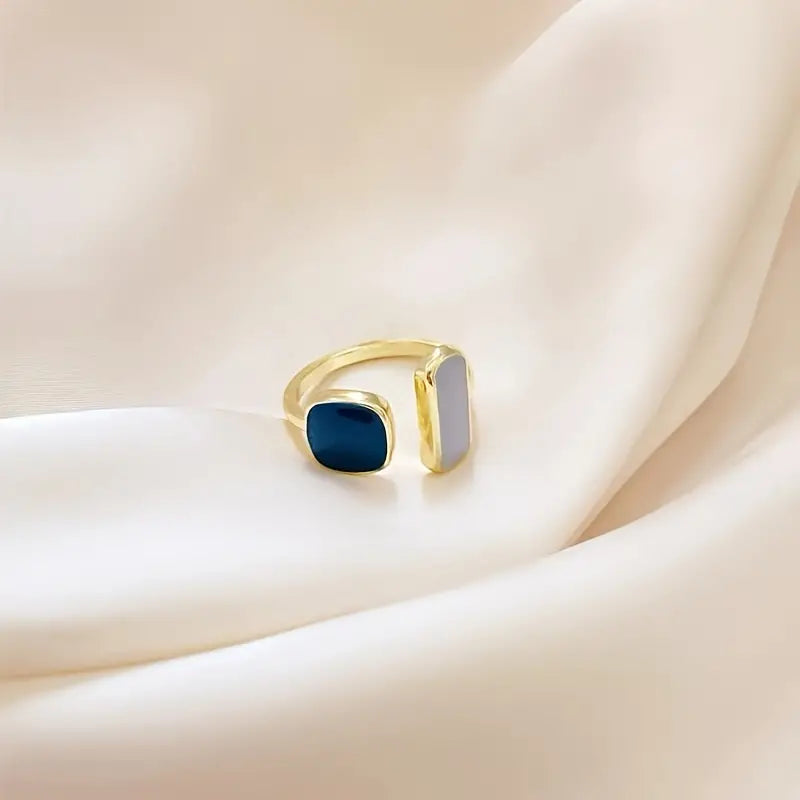 Anillo Calma - Put this ring on a stressful day and let your mind calm you through the day.This 14k gold plated Blue ring is your new reminder to rest and and calm your body and mind. The blue color causes the body to produce chemicals that are calming and release feelings of tranquility. Blue is also cooling in nature and helps with balance and self-expression. Calma Linda.  Item Detail: Blue-glazed Cuff Ring Golden  14K Gold Plated 40cm(15 6/8") long Adjustable, one size fits all 1 Piece