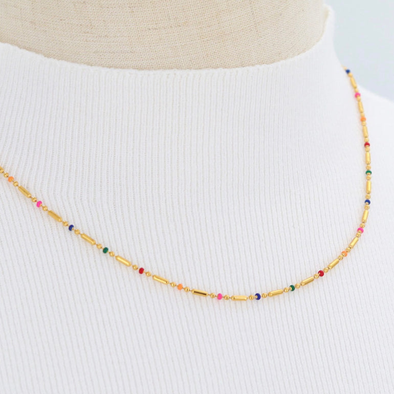 De colores, De colores se visten los campos En la primavera.... Tu sabes, that song we all sang in our childhood. The minute I set my eyes on this simple colorful ball chain necklace, that song popped in my head and I knew we had to have it. We, as in you and I and anyone you want to gift these too!     Item Detail: 8K Real Gold Plated 304 Stainless Steel Ball Chain Enamel Necklace  Colorful Ball Pendants 40cm(15 6/8") long 1 Piece